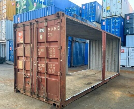 Cutting out both long sides of the container 20